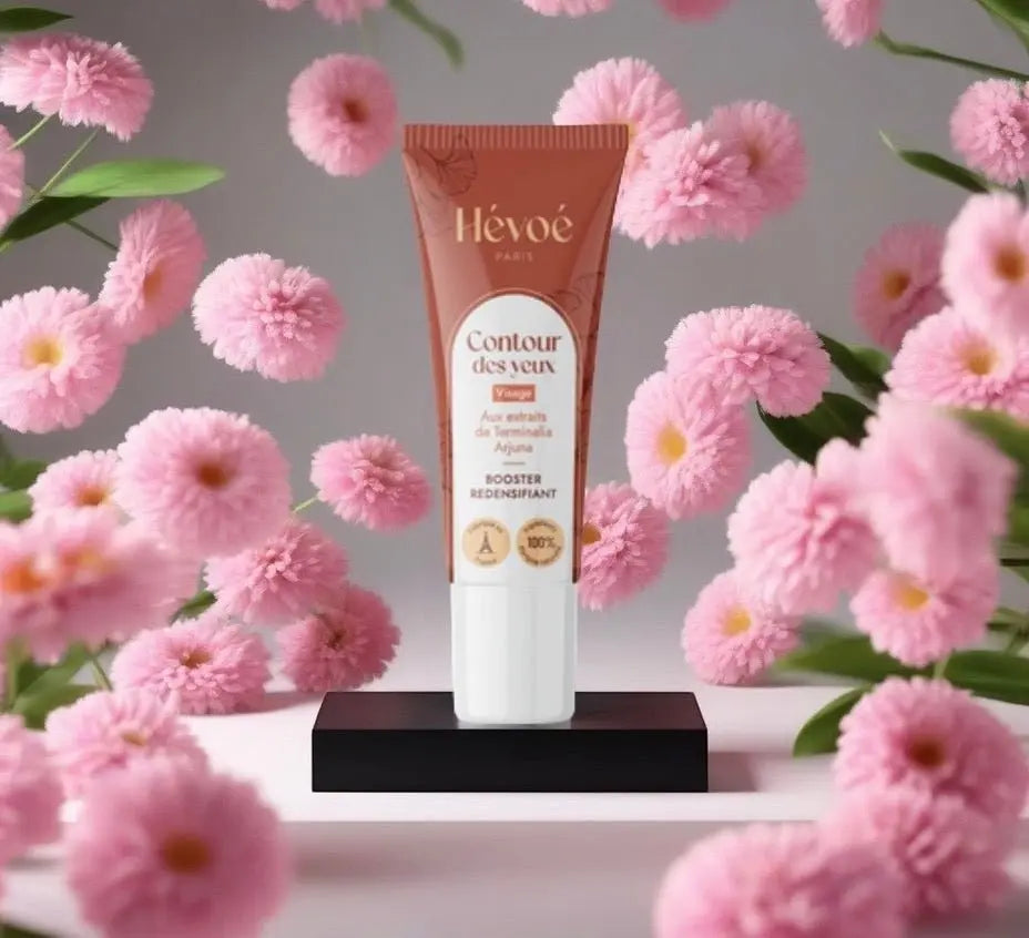 HEVOE Crème Contour des Yeux, booster redensifiant pour le visage, tube brun avec détails floraux roses.